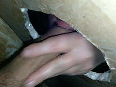 Mature wife gives an erotic blowjob at a gloryhole
