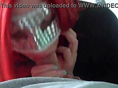 A mature redhead wife gives a passionate blowjob to her husband's large penis