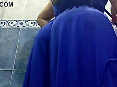 Latina mature woman urinates in a public restroom