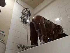 Black milf's big ass gets wet in the shower